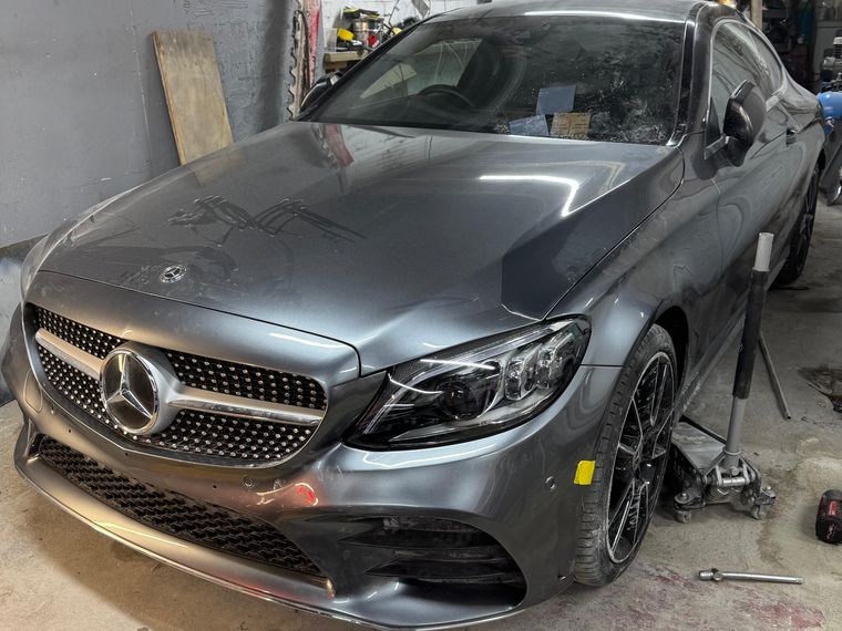 The same Mercedes-Benz C-Class with the front end rebuilt and resprayed inside the N17 Bodyworks workshop